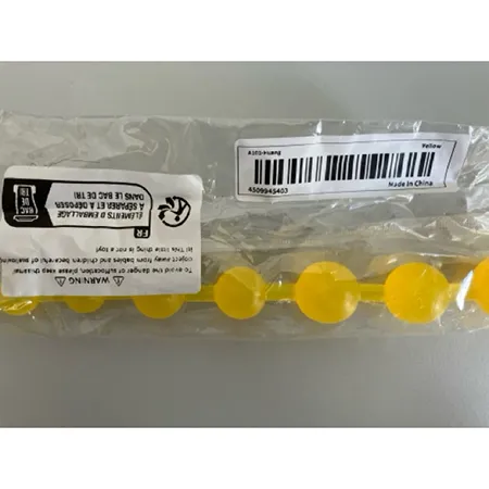 Boules d'orgasme en plastique jaune. Produit vendu en ligne, notamment via TEMU.