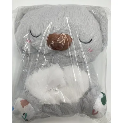 Koala en peluche à piles avec fonctions lumineuses et sonores. Produit vendu en ligne sur plusieurs sites d'expédition directe et marchés différents.