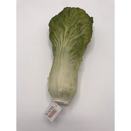 Décoration en plastique en forme de laitue. Produit vendu en ligne, notamment via mrplantshop.se