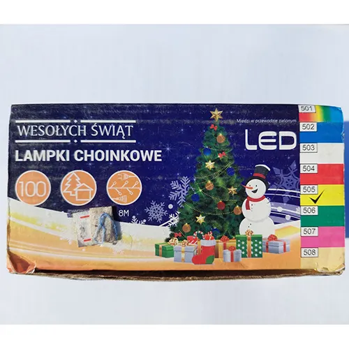Chaîne d'éclairage décorative avec des LED ambrées et un fil isolé vert foncé, avec une unité de commande à huit programmes et une option d'extension.