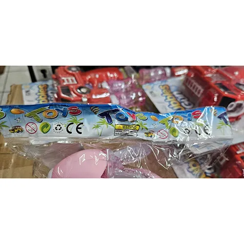 Jouet de lapin en plastique rose, avec un interrupteur. Le jouet avance, s'allume et produit de la musique lorsqu'il est allumé.