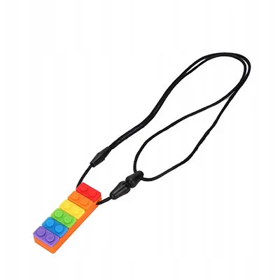 Jouet de dentition en plastique souple coloré, destiné aux bébés. Produit vendu en ligne, notamment via Allegro.pl.