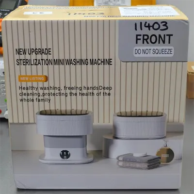 Petite machine à laver portable blanche. Produit vendu en ligne, notamment via Amazon (ASIN: B0F23MZ25N).