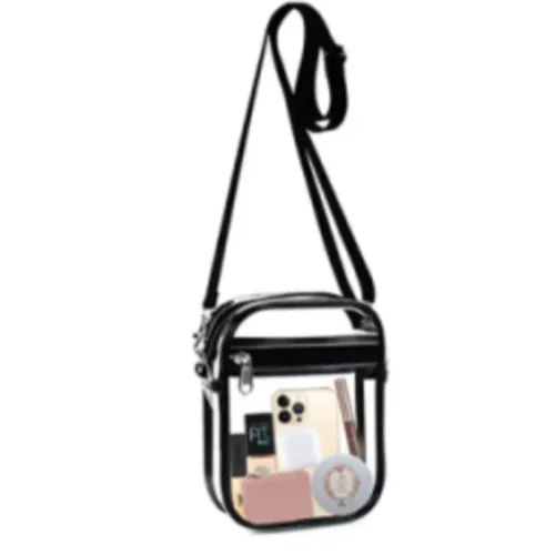 Sac à main en PVC transparent avec une sangle noire. Produit vendu en ligne, notamment via www.elkjop.no.