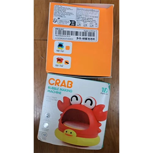Jouet de bain rouge et jaune en forme de crabe, avec une ouverture pour souffler des bulles. Produit vendu en ligne, notamment via Shein (identifiant unique: sl25050839197368833).