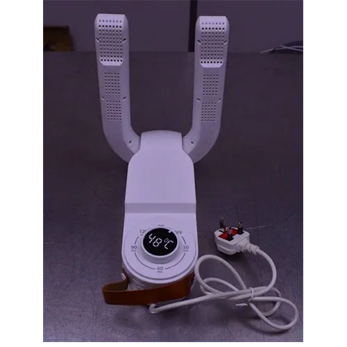 Une machine à sécher électrique blanche pour les chaussures.