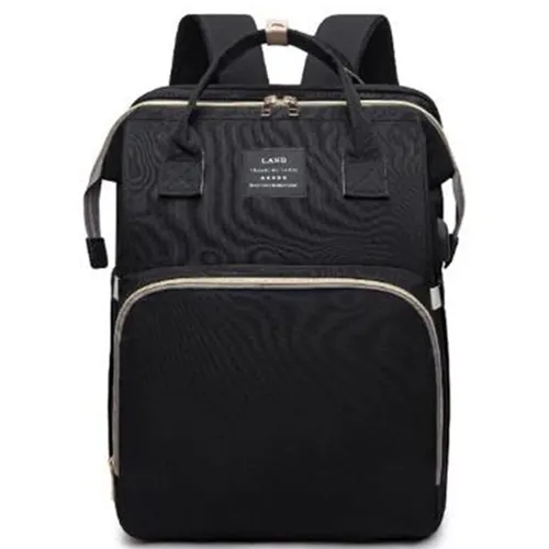 Sac à dos contenant un lit pliant avec plusieurs compartiments.