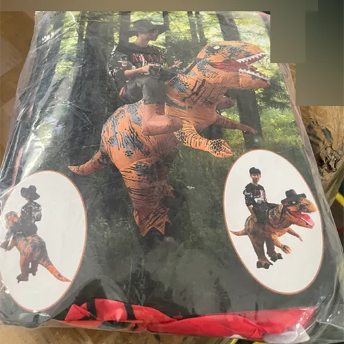 Costume gonflable de dinosaure de fantaisie, comprenant un ventilateur, un câble USB et un compartiment de batterie.