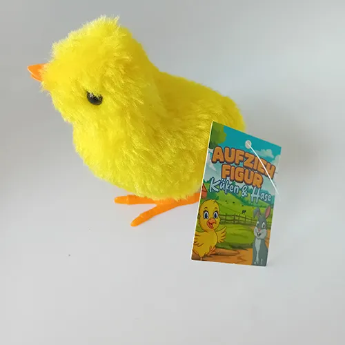 Jouet d'enroulement en forme de poulet en plastique rigide et recouvert de tissu doux. Lorsque la clé est enroulée, le jouet bouge.